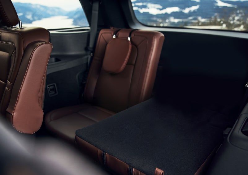 The left rear seat of a 2024 Lincoln Aviator® SUV is shown folded flat for additional cargo space | Vista Lincoln Woodland Hills in Woodland Hills CA