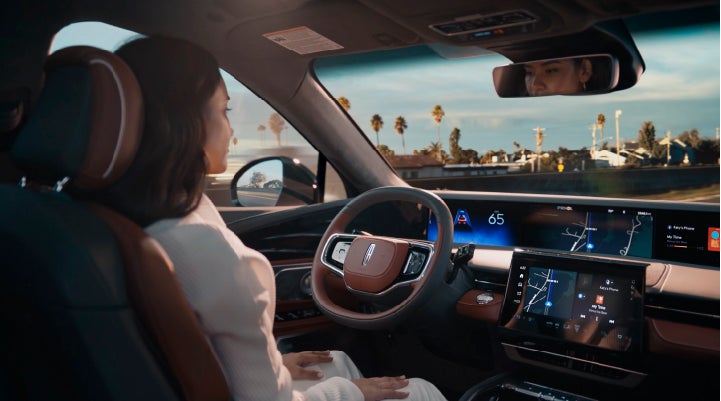 A person is shown driving hands-free on the highway with available Lincoln BlueCruise technology. | Vista Lincoln Woodland Hills in Woodland Hills CA