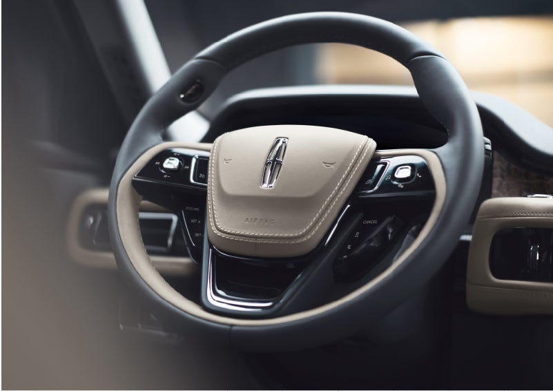 The intuitively placed controls of the steering wheel on a 2023 Lincoln Aviator® SUV | Vista Lincoln Woodland Hills in Woodland Hills CA