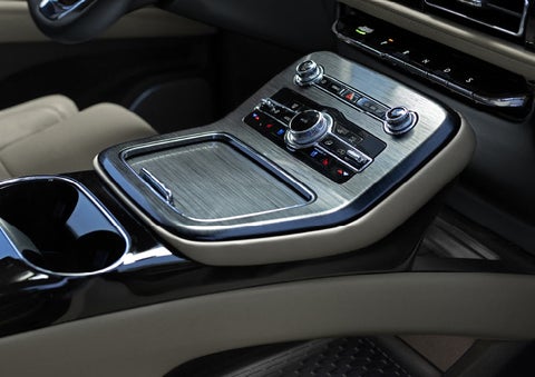 The many functions of the center console of a 2023 Lincoln Nautilus® SUV are shown.