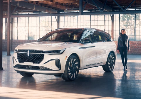 A person approaches a 2024 Lincoln Nautilus® SUV. | Vista Lincoln Woodland Hills in Woodland Hills CA