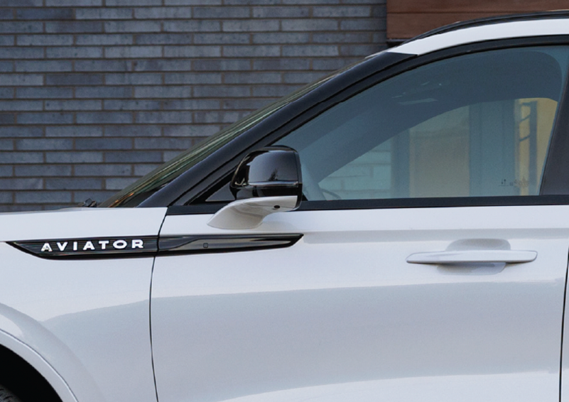 The driver’s door of a white 2025 Lincoln Aviator® SUV is showcased. | Vista Lincoln Woodland Hills in Woodland Hills CA