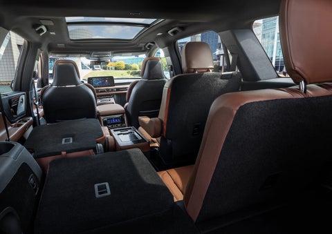 The interior of the 2025 Lincoln Aviator® SUV is shown with two seats folded down for added space. | Vista Lincoln Woodland Hills in Woodland Hills CA