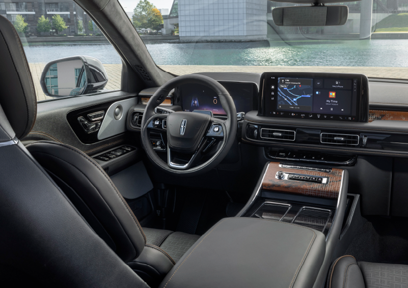 The interior of the 2025 Lincoln Aviator® SUV is shown parked with a view of a harbor through the windshield. | Vista Lincoln Woodland Hills in Woodland Hills CA