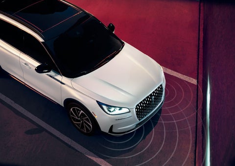 Illustrated radar signals are shown emitting from the front of a 2025 Lincoln Corsair® SUV. | Vista Lincoln Woodland Hills in Woodland Hills CA