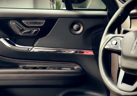 The driver of a 2024 Lincoln Corsair® SUV is shown selecting the drive mode. | Vista Lincoln Woodland Hills in Woodland Hills CA