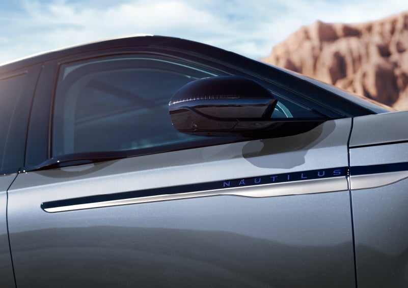 Blue lettering on the side of the vehicle that reads nautilus indicates the available hybrid powertrain. | Vista Lincoln Woodland Hills in Woodland Hills CA