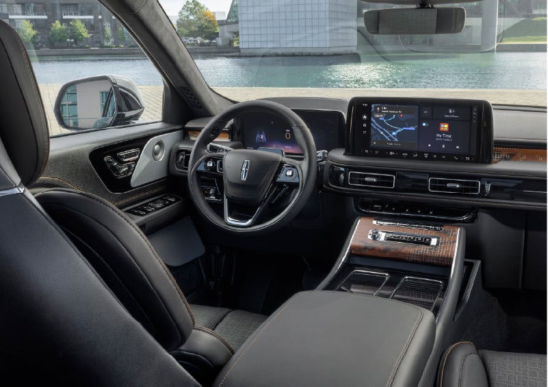 The interior of the 2026 Lincoln Aviator® SUV is shown parked with a view of a harbor through the windshield. | Vista Lincoln Woodland Hills in Woodland Hills CA
