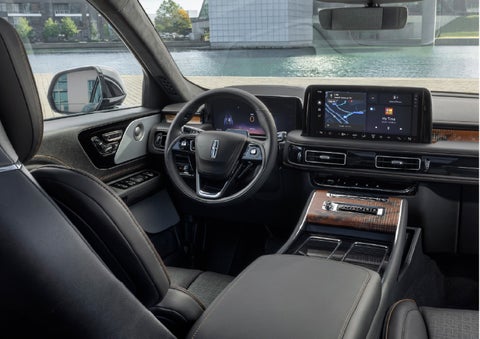 The interior of the 2026 Lincoln Aviator® SUV is shown parked with a view of a harbor through the windshield. | Vista Lincoln Woodland Hills in Woodland Hills CA