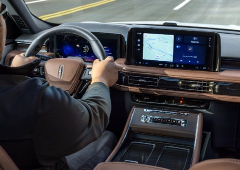 A person is driving a 2026 Lincoln Aviator® SUV as seen from inside the cabin. | Vista Lincoln Woodland Hills in Woodland Hills CA