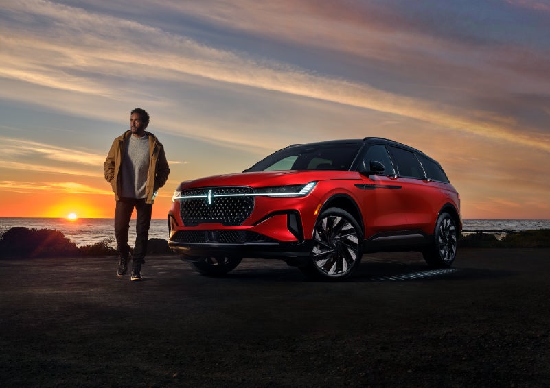 A person is shown next to a 2026 Lincoln Nautilus® SUV as the Lincoln Embrace sequence takes place. | Vista Lincoln Woodland Hills in Woodland Hills CA